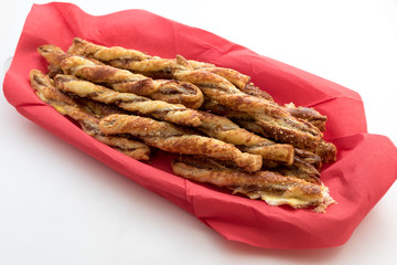 Bread stiks in a red basket