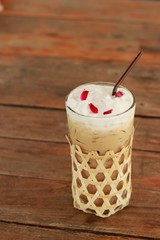 glass of milk on blue background