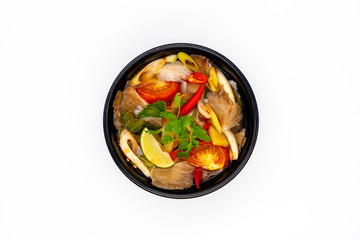 Fototapeta na wymiar Vegetarian Thai sour clear soup called Mushroom Tom Yum