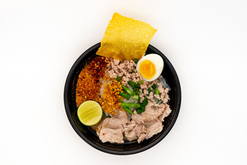 Thai Pork Noodles soup and boiled egg on white background