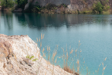 Emerald blue pool in tropical rainforest