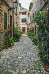 Fototapeta na wymiar empty street with cobble stones in Valldemossa, Mallorca, Spain