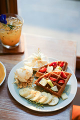 Waffle of fresh berries  strawberry, blueberry, bananas and chocolate topping,Sweet dessert cafe