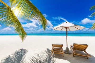 Luxury vacation, summer vibes. Tranquil beach scene. Exotic tropical beach landscape for background or wallpaper. Design of summer vacation holiday concept. Exotic travel destination