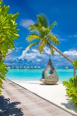 Zelfklevend Fotobehang Tropical beach background as summer landscape with beach swing or hammock and white sand and calm sea for beach banner. Perfect beach scene vacation and summer holiday concept. Boost up color process © icemanphotos