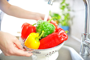 Washing vegetables.	