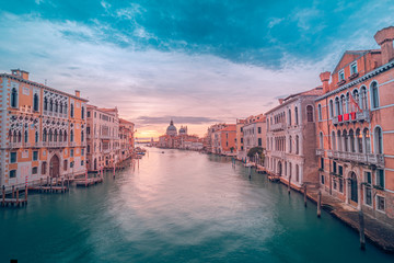 Famous travel destination, Venice Italy sunset view over Grand Canal. Peaceful sunset landscape with colorful sky. Amazing scenery concept, travel and adventure banner
