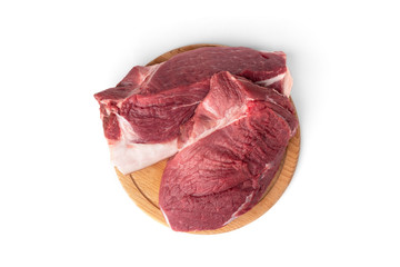 Obraz premium Raw pork shoulder meat on wooden board isolated on white background.