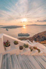 Fira town, with view of caldera, volcano and cruise ships, Santorini, Greece. Cloudy dramatic sky.