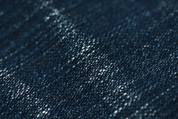 Jeans denim texture close up , focus only one point , soft blured background wallpaper
