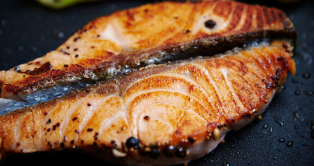 Grilled salmon fillet on frying pan