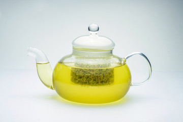 fennel seeds loose inside glass teapot brewed for healthy drink on white background