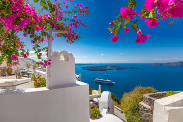 Amazing travel landscape in Santorini, Greece. White architecture with pink flowers under blue sky. Tranquil caldera view, summer landscape, peaceful scenery for summer vacation and holiday - obrazy, fototapety, plakaty