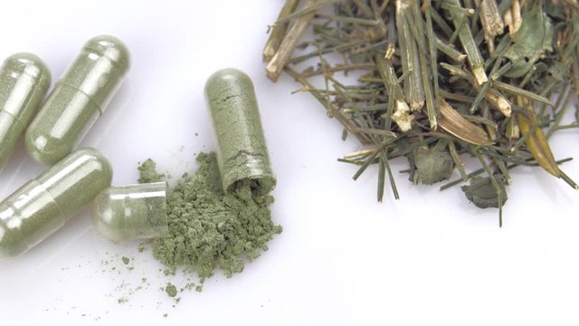 Fa thalai chon, kariyat herb antiviral activity (Andrographis Paniculata) Capsules on a white background.