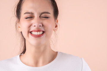 Fototapeta premium beautiful asian attractive female face close up casual dress laugh and big smile happiness surprise expression,pretty asian woman toothy smile wide mouth color background