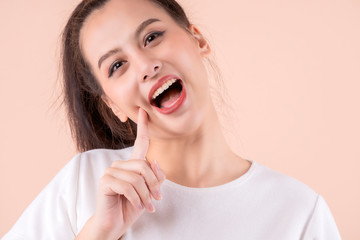 Fototapeta premium beautiful asian attractive female face close up casual dress laugh and big smile happiness surprise expression,pretty asian woman toothy smile wide mouth color background