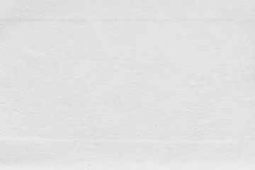 Cardboard white texture close-up. Light old paper background. Grunge concrete wall. Vintage blank wallpaper.