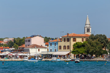 Fototapeta na wymiar FAZANA / CROATIA - AUGUST 2015: View to the bay of Fazana town in Istria, Croatia