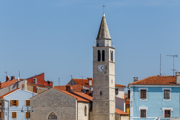 Fototapeta na wymiar Main square and church with bell tower in Fazana town, Istria, Croatia
