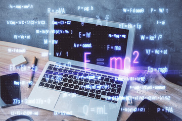 Desktop computer background and formula hologram writing. Double exposure. Education concept.