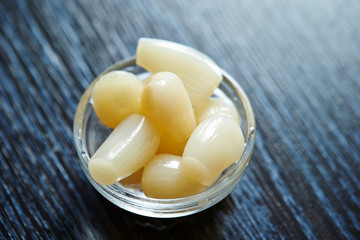 Chinese onion pickle in small glass dish 