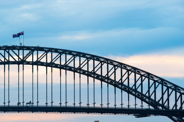 Fototapeta na wymiar Sydney Harbour Bridge with cloudy blue sky.