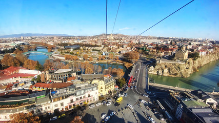 Tbilisi cable car view of the city from the top station, cable car cabins on the background of the old town