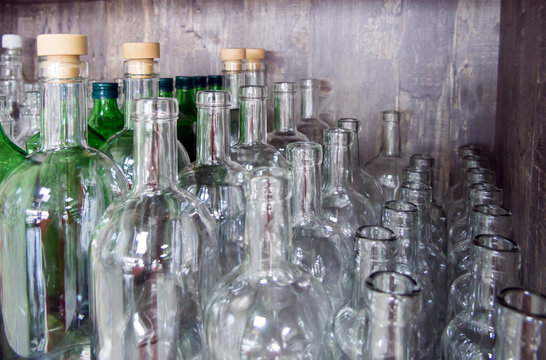 A row of glass bottles for home alcoholic drinks