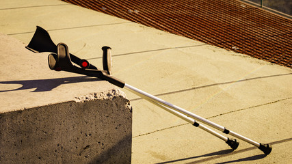 Crutches outdoor on bench.