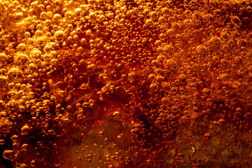 Background of cola with ice and bubbles. Side view background of refreshing cola flavored soda with carbonated with vintage tone