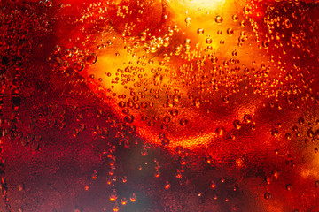 Background of cola with ice and bubbles. Side view background of refreshing cola flavored soda with carbonated with vintage tone