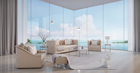 Luxury beach house.Sofa,armchair,stool,side table,lamps,curtains in living room with infinity edge swimming pool and sea view outside.Vacation home or holiday villa.3d rendering - obrazy, fototapety, plakaty