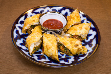 Puff pastry with vegetables and tomato sauce