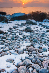 Coastal winter landscape at sunset, Sweden.