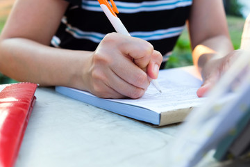 Close up female hands of accountant with calculator and pen. business accounting background. 