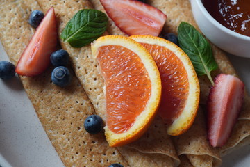 Healthy salad with couscous, fresh mint, cucumber, pomegranate, lemon and olive oil. Eastern cuisine. Vegan food concept. Traditional Israeli food