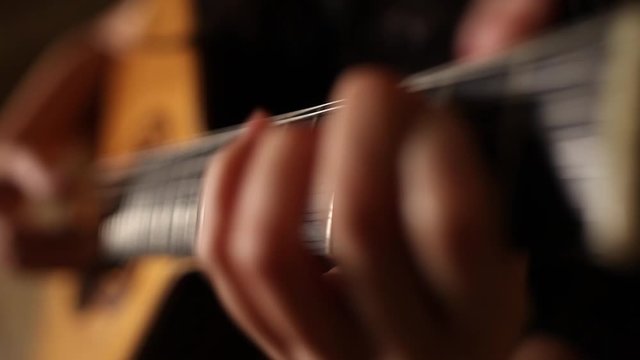 playing twelve steel strings portuguese guitar fado