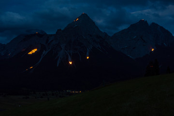 Traditional mountain fire and solstice fire near Ehrwald at the Tiroler Zugspitz Arena