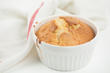 Homemade pastries: cupcake in round ceramic shape decorated with linen towel