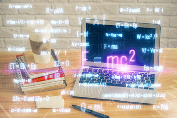 Desktop computer background and formula hologram writing. Double exposure. Education concept.