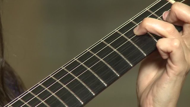 playing twelve steel strings portuguese guitar fado