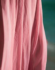 Pink fabric on a dress in the wind