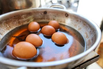 Eggs are boiled in a pan in the kitchen