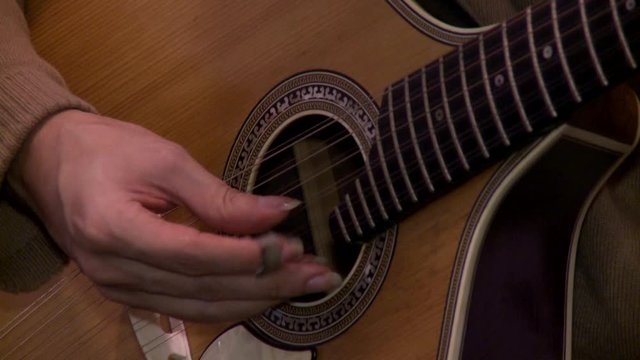 playing twelve steel strings portuguese guitar fado