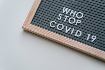 Who Stop Coronavirus. Covid-19 warning concept banner. Flat lay felt board coronavirus typography design.