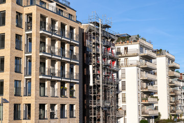 Fototapeta premium Modern apartment buildings seen in Frankfurt, Germany, one of them still under construction