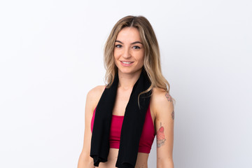 Young sport woman over isolated white background with sport towel