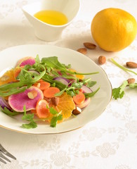 Citrus salad with radishes, carrots and arugula.