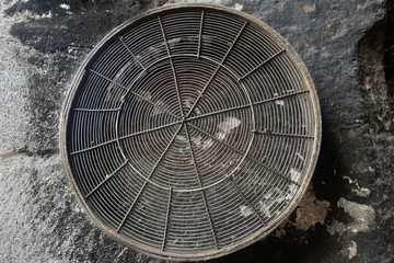large screened sieve hanging on a concrete wall, Istanbul, Turkey