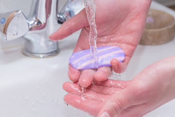 A man washes his hands with soap. Close-up photo. Prevention of viral diseases and covid - 19. Keeping your hands clean.